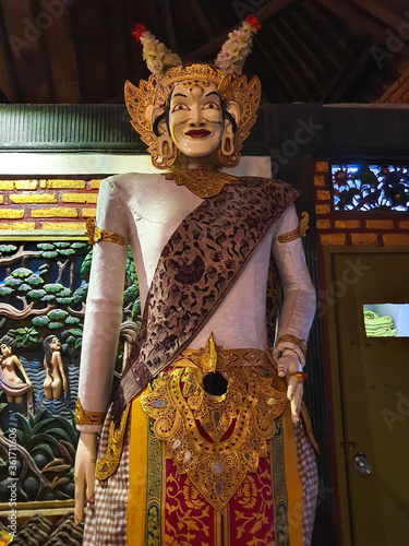 Traditional Balinese statue on a public spot representing ancient art and history. Bali, Indonesia photo