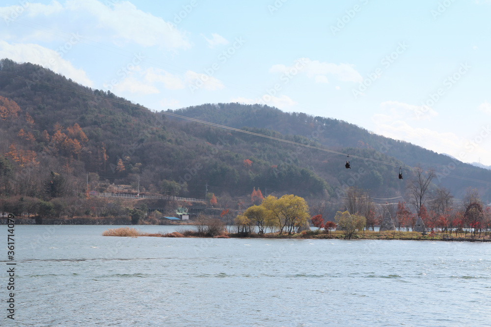 Autumn scenery of Nami Island in sunny day with skyline zip-wire, South Korea