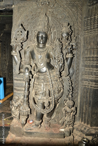 Sculptures and friezes on the walls of The Chennakeshava Temple or Vijayanarayana Temple of Belur, is a 12th-century Hindu temple in the Hassan district of Karnataka state, India.  photo