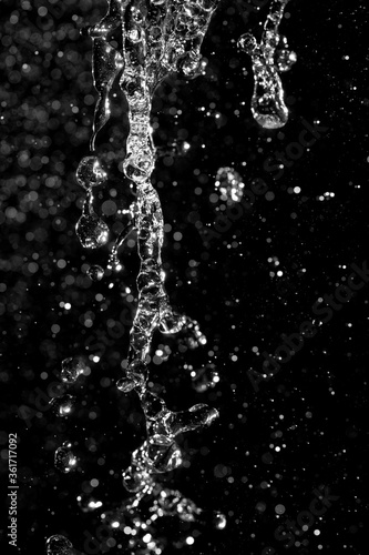 water jet with splashes and highlights on a black background