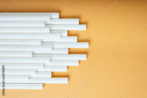 Background of white plastic straw in shape of music rhytm.