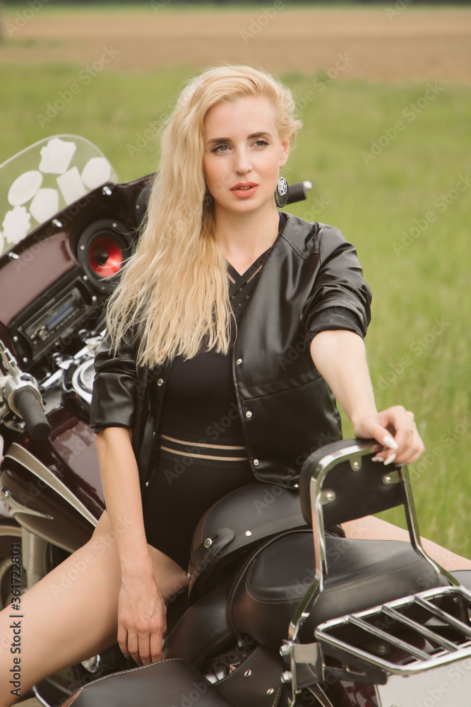 Blonde girl on a motorcycle