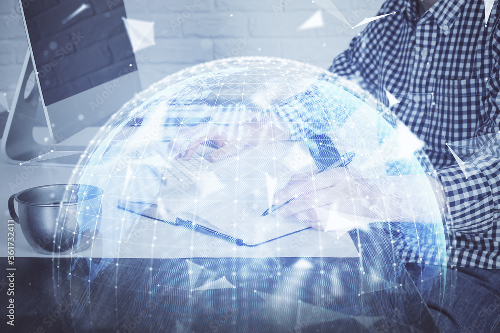 Multi exposure of businessman working on laptop on background. International business hologram in front. Concept of success. Multi exposure of businessman working on laptop on background. International business hologram in front. Concept of success.