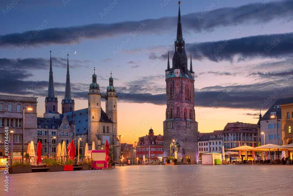 Halle, Germany. Cityscape image of historical downtown of Halle (Saale) with the Red Tower and the Market Place during dramatic sunset.