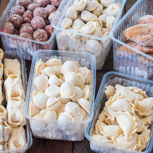 Assortment of Pocket items. Semifinished meatballs, dumplings, pierogi. photo