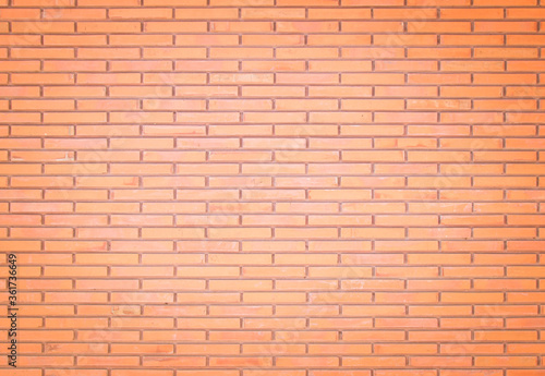 Background of wide old red brick wall texture. Old Orange brick wall concrete or stone wall textured  wallpaper limestone abstract flooring Grid uneven interior rock. Home or office design backdrop.