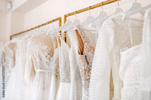 Slika na platnu Bridal dresses collection at showroom. Luxury bridal gowns shop.