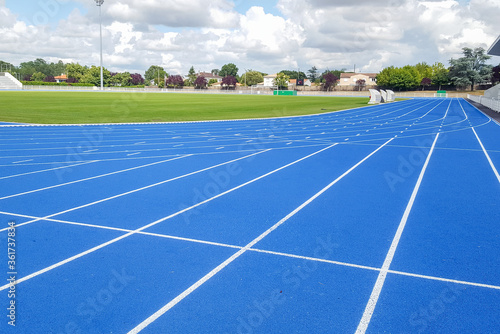 Athletics running track blue treadmill in sport stadium field
