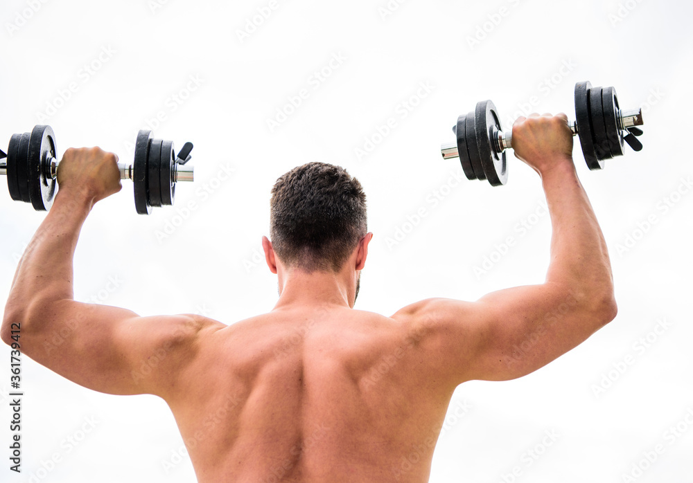 Actions speak louder than coaches. Sportsman with strong back and arms. Sport equipment. Bodybuilding sport. Sport lifestyle. Dumbbell exercise gym. Muscular man exercising with dumbbell rear view Actions speak louder than coaches. Sportsman with strong back and arms. Sport equipment. Bodybuilding sport. Sport lifestyle. Dumbbell exercise gym. Muscular man exercising with dumbbell rear view