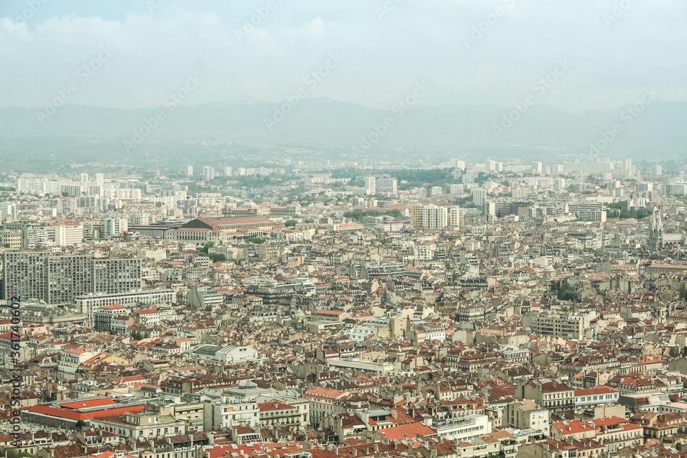 Aerial view of Marseille, with a focus on Belsunce and Saint Charles, districts with a high urban density, during a polluted day. Marseille is a Mediterranean port and the second biggest French city