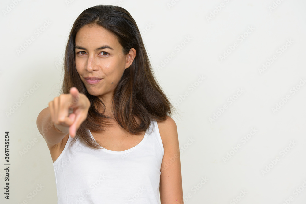 Portrait of beautiful multi ethnic woman pointing at camera Portrait of beautiful multi ethnic woman pointing at camera