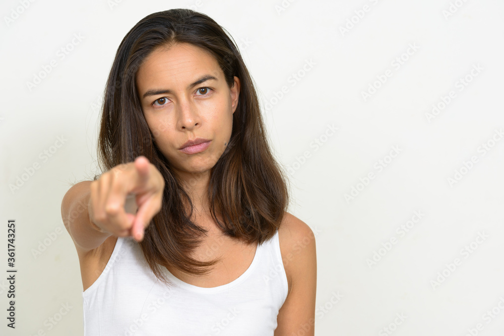 Portrait of stressed multi ethnic woman pointing at camera Portrait of stressed multi ethnic woman pointing at camera