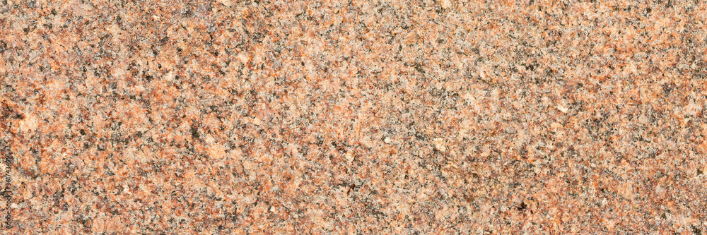 Granite texture. Natural granite with a grainy pattern. Stone background. Solid rough surface of rock. Durable construction and decoration material. Close-up. Granite texture. Natural granite with a grainy pattern. Stone background. Solid rough surface of rock. Durable construction and decoration material. Close-up.