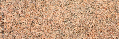 Panel kuchenny z motywem Granite texture. Natural granite with a grainy pattern. Stone background. Solid rough surface of rock. Durable construction and decoration material. Close-up.