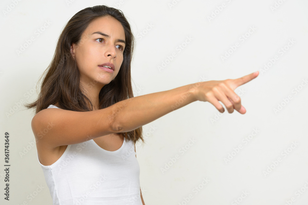 Portrait of stressed multi ethnic woman pointing finger Portrait of stressed multi ethnic woman pointing finger