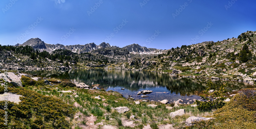 Naklejka premium Panoramic lake at llac dels pessons route in Andorran Pyrenees