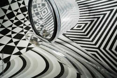 Can the insects even breathe under glass and plastic cup? Or maybe they just self trapped night flies as a metaphor.