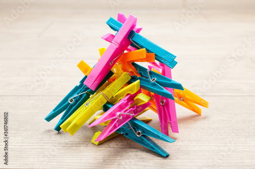 clothes pegs isolated on wooden background