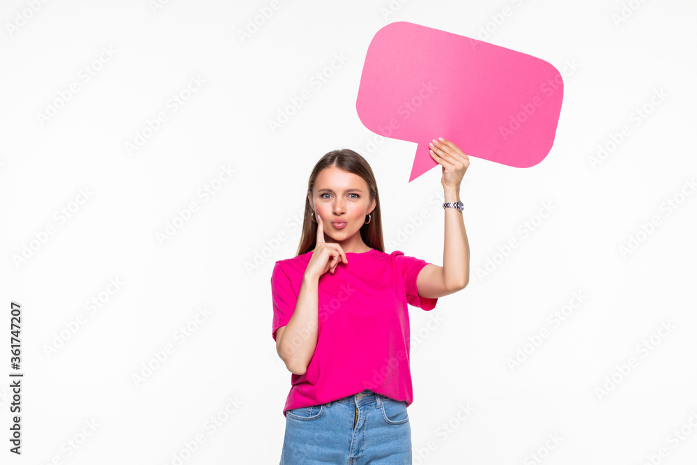 Young beautiful girl holding a speech bubble for text, isolated on a white background Young beautiful girl holding a speech bubble for text, isolated on a white background