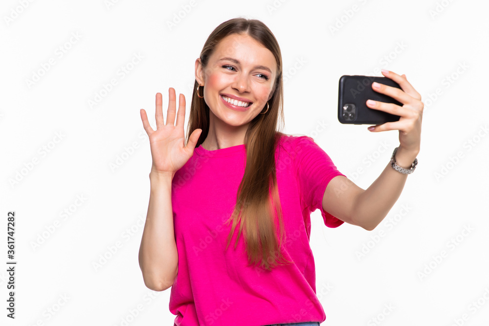 Young woman browsing in smartphone or have video call on white background Young woman browsing in smartphone or have video call on white background