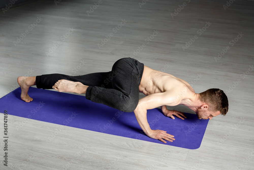 Young man is doing push-ups with knee tap. Young man is doing push-ups with knee tap.