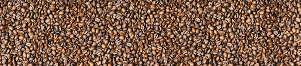 Roasted coffee beans background - full frame detail. Close up of a brown surface texture of aroma black caffeine drink ingredient for coffee beverage. Wide format banner Roasted coffee beans background - full frame detail. Close up of a brown surface texture of aroma black caffeine drink ingredient for coffee beverage. Wide format banner