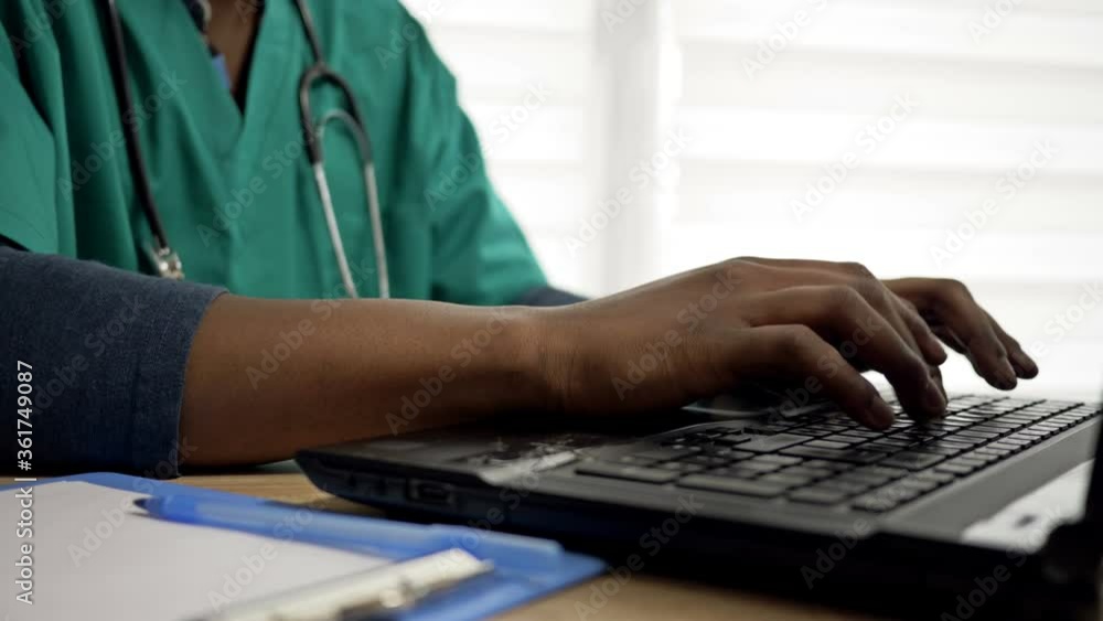 custom made wallpaper toronto digitalBlack doctor works at a computer in his office. Close up of black doctor hands typing on laptop.