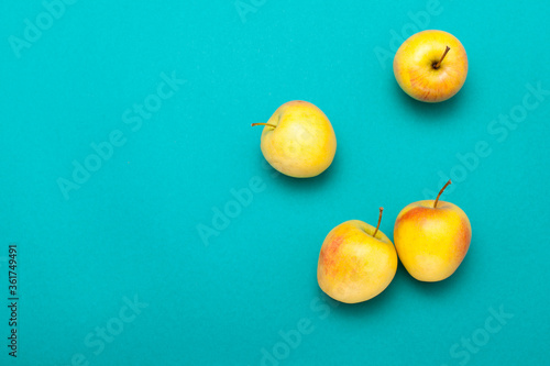 four apples isolated on color background, view of top