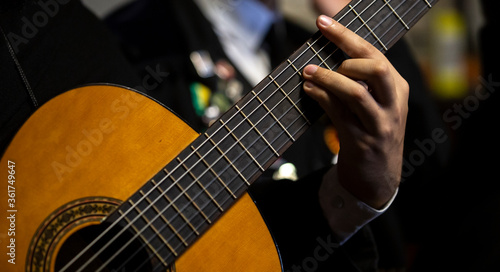 Details from a Portuguese guitar musician of an Academic Tuna, Braga, Minho, Portugal. photo