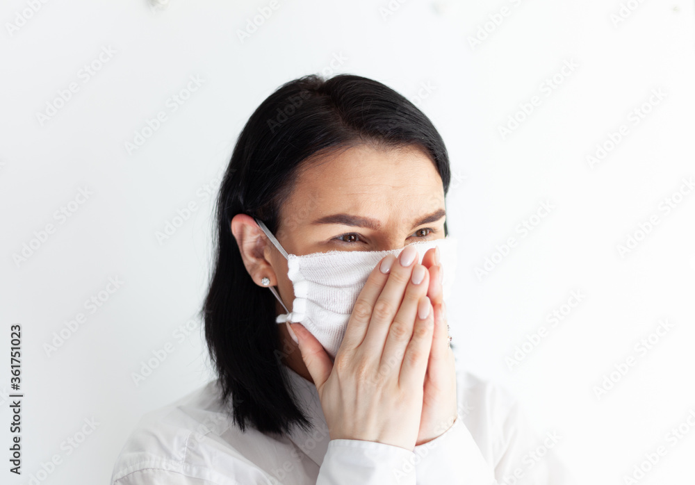woman in medical mask on a white background