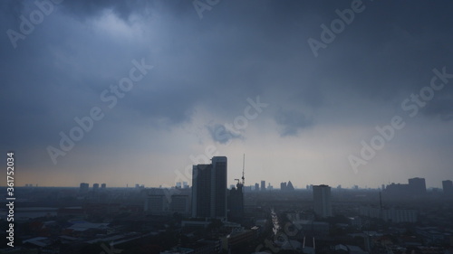 Aerial view, Tropical storm with heavy rain, high winds storm clouds fast moving over the city skyline.