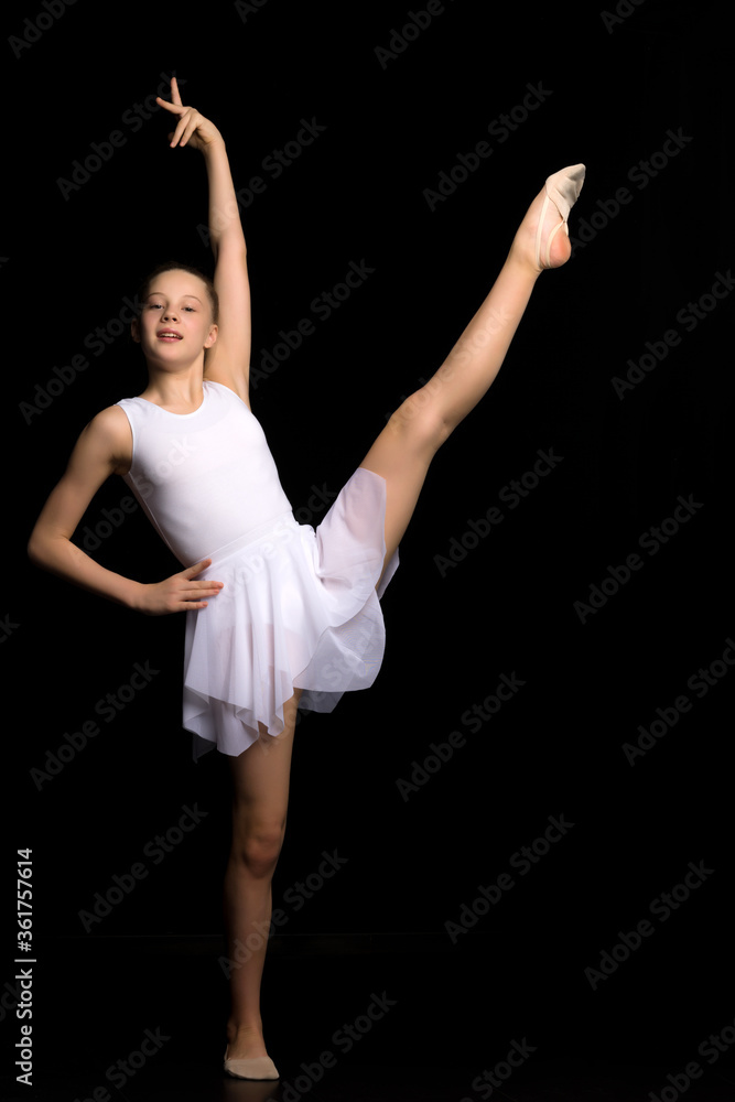 Full length portrait of a charming gymnast girl in elegant dress.