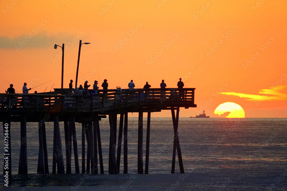 Beautiful sunrise overlooking the fishing pier at Virginia Beach, U.S.A