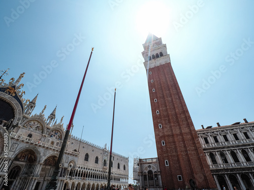 Venice, Italy - July 2020 Saint Marcus Square, the cathedral, tower and Doge s Palace durig summer time. photo