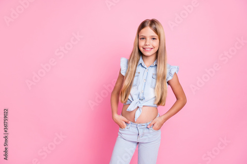 Portrait of her she nice attractive pretty cute lovely content cheerful cheery preteen girl wearing modern look isolated over pink pastel color background photo