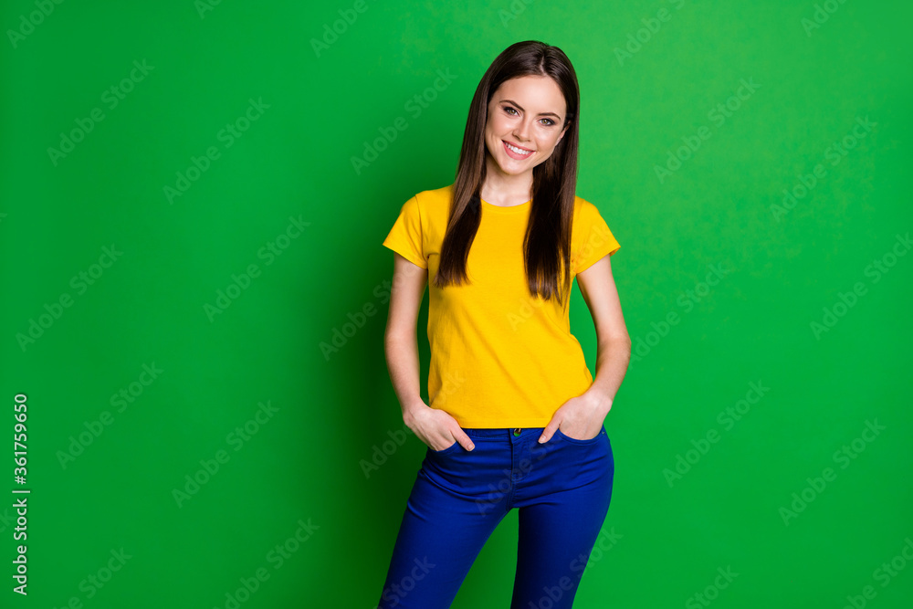 Portrait of content sweet youngster girl put hands pocket enjoy summer weekend holiday wear casual style clothes isolated over vibrant color background Portrait of content sweet youngster girl put hands pocket enjoy summer weekend holiday wear casual style clothes isolated over vibrant color background