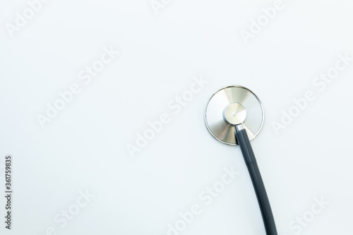 Stethoscope on light background, medical supplies and free space for text