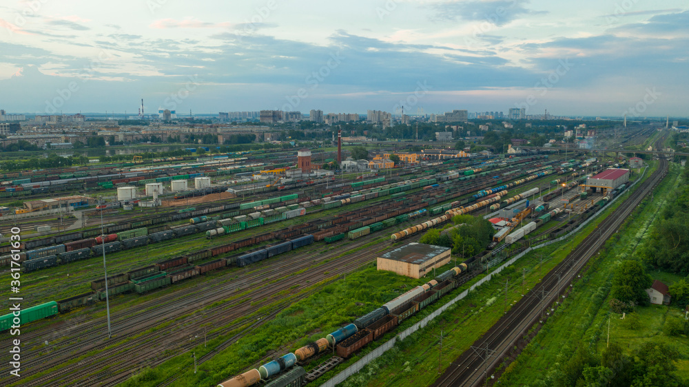 Large railway station with freight trains. Aerial view