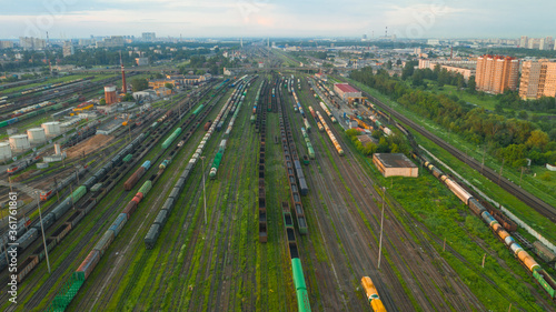 Large railway station with freight trains. Aerial view