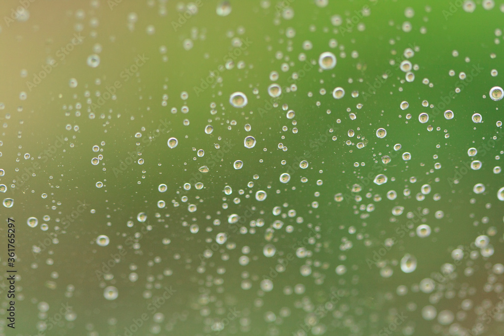 Abstract texture of blurry water drops on glass
