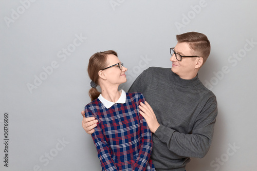 Portrait of happy man and woman looking at each other and smiling