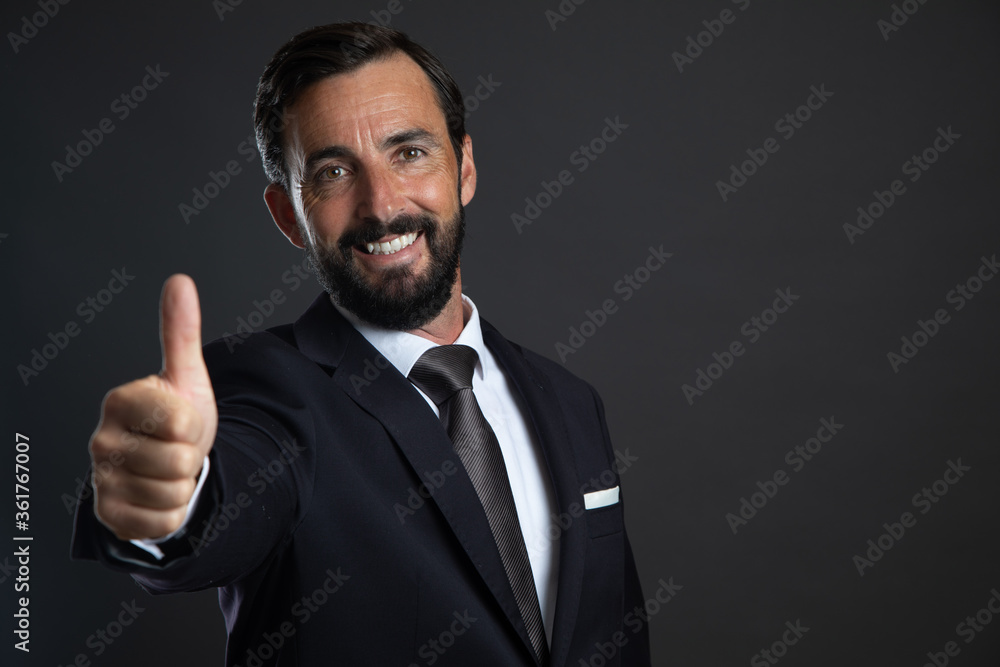 a man in a suit isolated on gray background a man in a suit isolated on gray background
