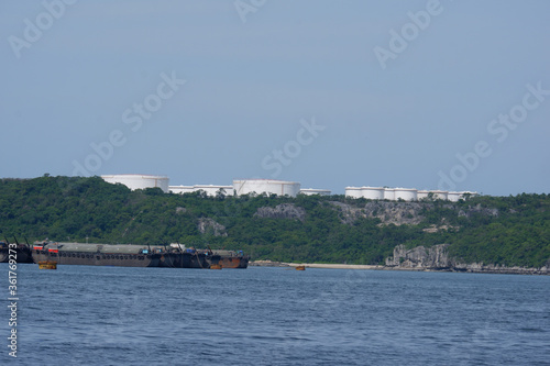 Crude oil storage tank on the island in the sea © ek