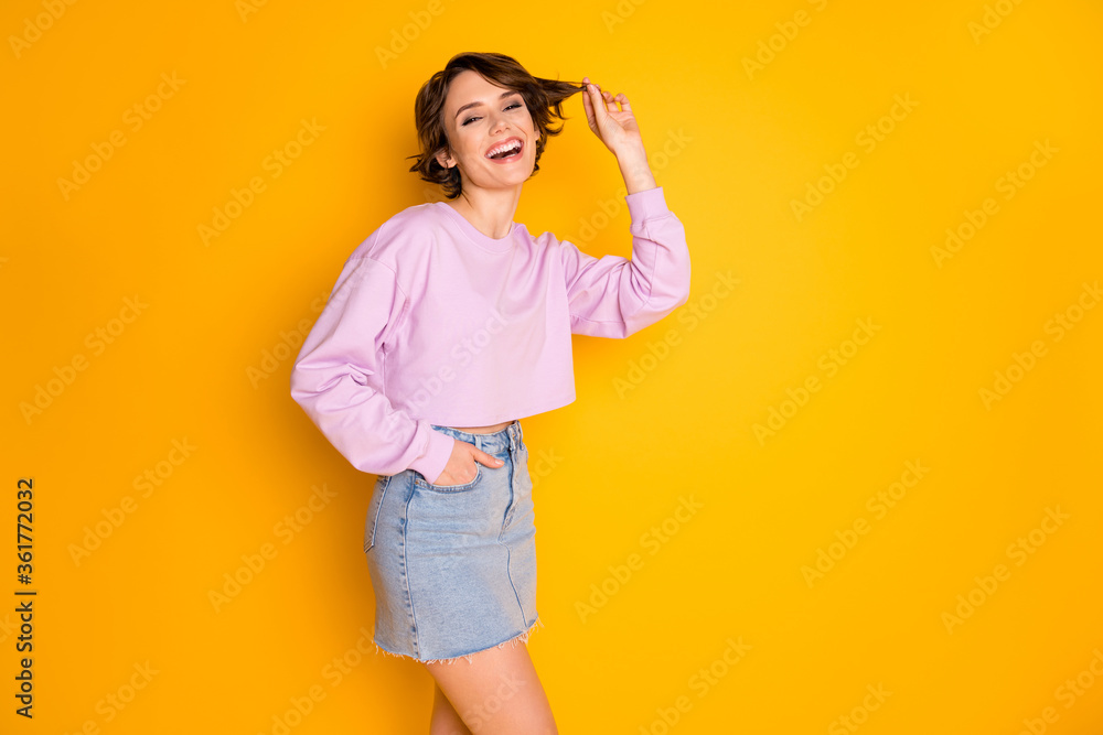 Portrait of her she nice attractive lovely pretty cute charming cheerful cheery girl playing with curl isolated on bright vivid shine vibrant yellow color background - obrazy, fototapety, plakaty 