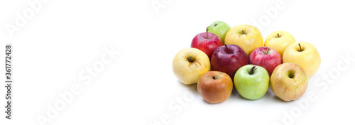 Natural organic apples on white background. Various fresh ripe apples in different colors: red yellow green orange. copy space.
