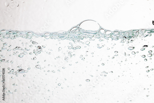 Closeup bubbles underwater on white background.