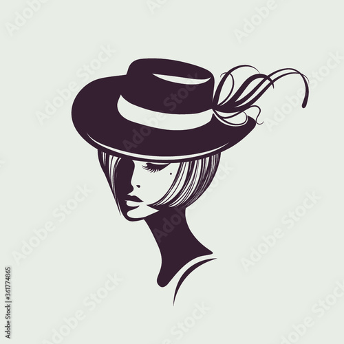 Beautiful woman with retro, wavy hairstyle and elegant makeup.Cute portrait.Fashion icon.Young lady wearing a stylish hat.Face silhouette.Decorative elements.