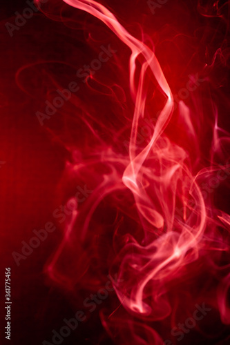 Red smoke motion on black background.