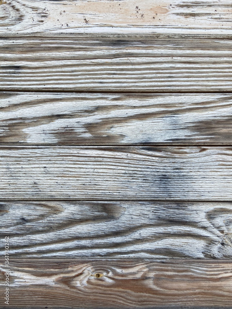 Old light brown wavy horizontal texture of wooden boards Old light brown wavy horizontal texture of wooden boards