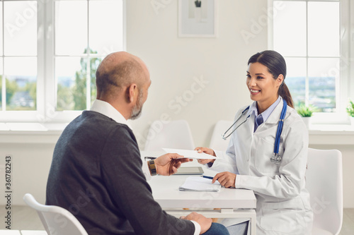 Senior man patient visiting doctor at clinic.